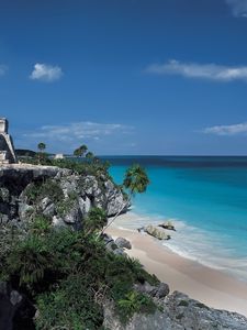 Preview wallpaper rocks, palm trees, structure, stone, architecture, break, blue water