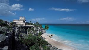 Preview wallpaper rocks, palm trees, structure, stone, architecture, break, blue water