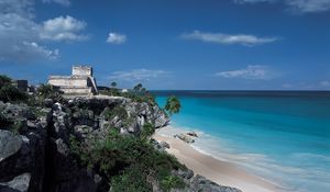 Preview wallpaper rocks, palm trees, structure, stone, architecture, break, blue water