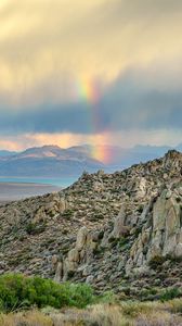 Preview wallpaper rocks, relief, clouds, rainbow, landscape