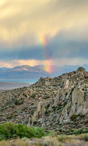 Preview wallpaper rocks, relief, clouds, rainbow, landscape