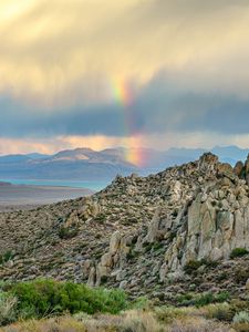 Preview wallpaper rocks, relief, clouds, rainbow, landscape