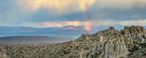 Preview wallpaper rocks, relief, clouds, rainbow, landscape