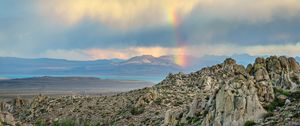 Preview wallpaper rocks, relief, clouds, rainbow, landscape