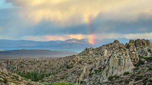 Preview wallpaper rocks, relief, clouds, rainbow, landscape