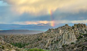 Preview wallpaper rocks, relief, clouds, rainbow, landscape