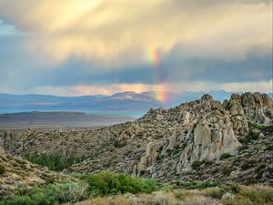 Preview wallpaper rocks, relief, clouds, rainbow, landscape