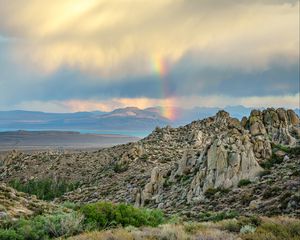 Preview wallpaper rocks, relief, clouds, rainbow, landscape