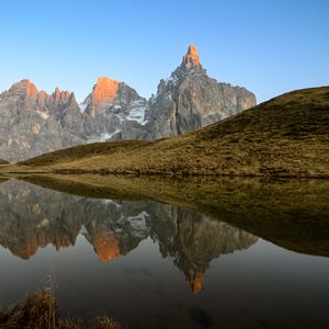 Preview wallpaper rocks, relief, lake, hill, reflection