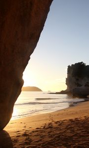 Preview wallpaper rocks, sand, footprints, sea, waves