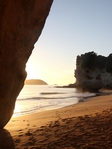 Preview wallpaper rocks, sand, footprints, sea, waves