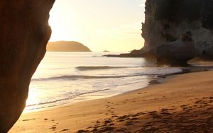 Preview wallpaper rocks, sand, footprints, sea, waves