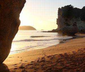 Preview wallpaper rocks, sand, footprints, sea, waves