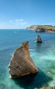 Preview wallpaper rocks, sea, boats, landscape, sky