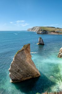 Preview wallpaper rocks, sea, boats, landscape, sky