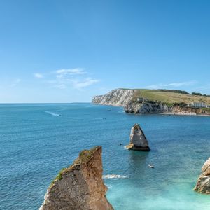 Preview wallpaper rocks, sea, boats, landscape, sky