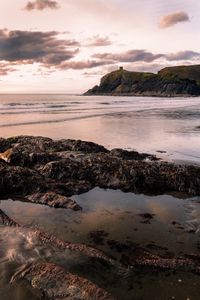 Preview wallpaper rocks, sea, coast, building, cliff