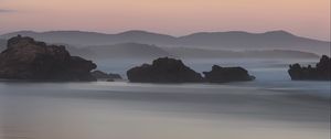 Preview wallpaper rocks, sea, fog, hills, landscape, dawn