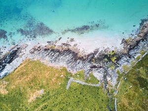 Preview wallpaper rocks, sea, grass, aerial view