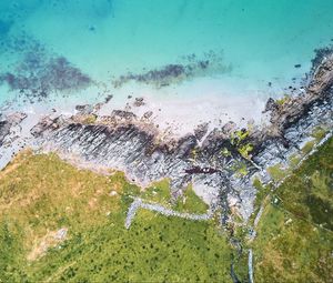 Preview wallpaper rocks, sea, grass, aerial view