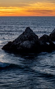 Preview wallpaper rocks, sea, horizon, landscape, nature, evening