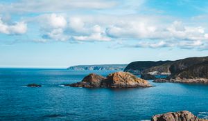 Preview wallpaper rocks, sea, horizon, clouds, sky