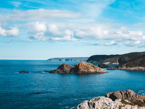 Preview wallpaper rocks, sea, horizon, clouds, sky