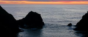 Preview wallpaper rocks, sea, horizon, twilight