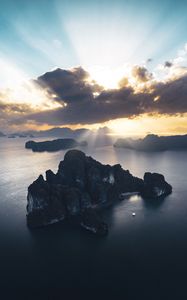Preview wallpaper rocks, sea, rays, distance
