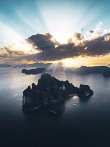 Preview wallpaper rocks, sea, rays, distance