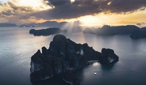 Preview wallpaper rocks, sea, rays, distance