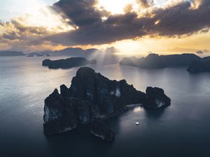 Preview wallpaper rocks, sea, rays, distance