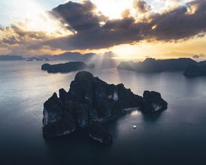 Preview wallpaper rocks, sea, rays, distance