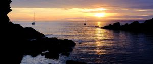 Preview wallpaper rocks, sea, ships, silhouettes, twilight