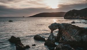 Preview wallpaper rocks, sea, sunset, sky, horizon