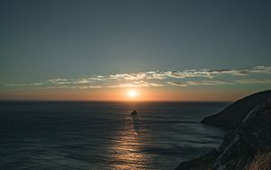 Preview wallpaper rocks, sea, sunset, sun, slope, grass