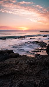 Preview wallpaper rocks, sea, sunset, horizon, clouds
