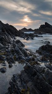 Preview wallpaper rocks, sea, sunset, coast, landscape