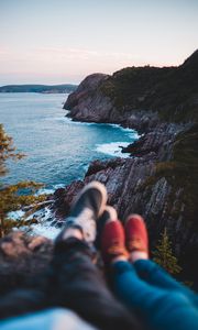 Preview wallpaper rocks, shore, sea, legs