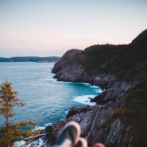 Preview wallpaper rocks, shore, sea, legs