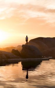 Preview wallpaper rocks, silhouette, sunset, water, south africa