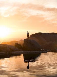 Preview wallpaper rocks, silhouette, sunset, water, south africa