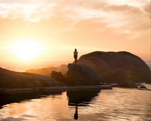 Preview wallpaper rocks, silhouette, sunset, water, south africa