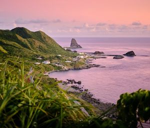 Preview wallpaper rocks, slope, coast, grass, sunset