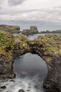 Preview wallpaper rocks, stones, arch, sea, clouds