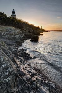 Preview wallpaper rocks, stones, lighthouse, bushes, nature