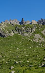 Preview wallpaper rocks, stones, mountains, grass, sky, slope