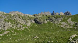 Preview wallpaper rocks, stones, mountains, grass, sky, slope