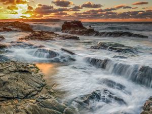 Preview wallpaper rocks, stones, reefs, sea, waves, sunset