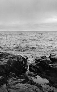 Preview wallpaper rocks, stones, sea, horizon, black and white